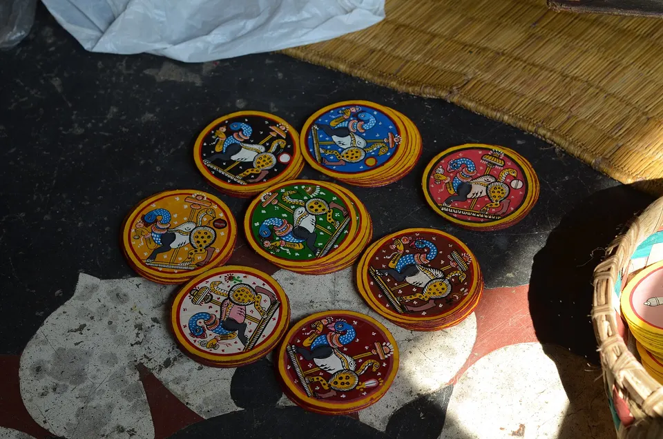 Round ganjapa cards laid out in the sun.